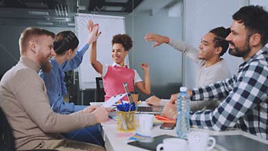 Team Celebrating Agreement in Office Meeting