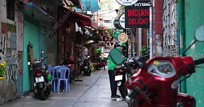 Vietnam Ho Chi Minh City 06.03.2024 Saigon evening people People walk around the city, sit in cafes, ride motorcycles