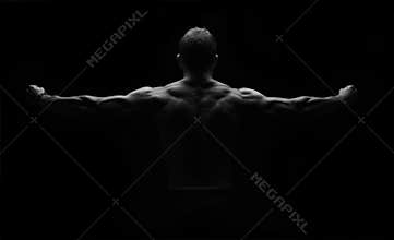 Strong fitness man flexing