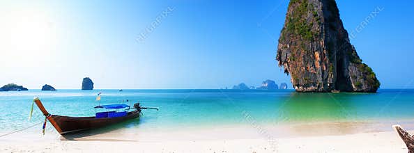 Travel boat on Thailand island beach. Tropical coast Asia landscape background