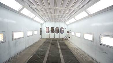 Metal paint-spraying booth with many lights for