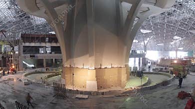 Workers constructing airport control tower, wide.