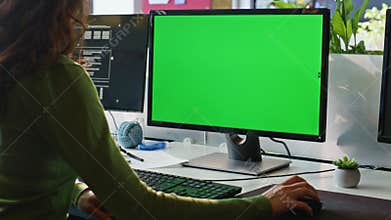 Employee watching greenscreen computer workplace closeup. Businesswoman working
