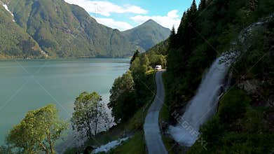 Experience the serene beauty of the Norwegian Fjord Road near Fjaerlands Fjord Norway