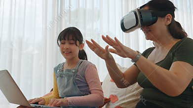 Granddaughter guide grandmother to dive in metaverse with VR. Divergence.