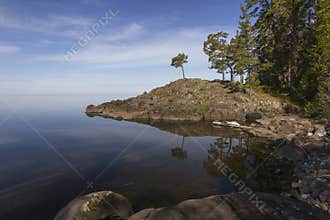 Stone shore by the tranquil Lake Ladoga