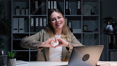Happy Freelancer Showing Heart Shape Hand Sign In Love In The Office