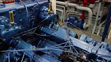 Engine of boat.The engine room of a boat with valves, vents, exhaust, pipes and plumbing
