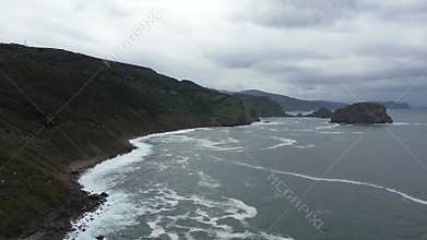 The north of Spain, the Basque Country, a drone view of the overcast sky, the rocky coast and the ocean