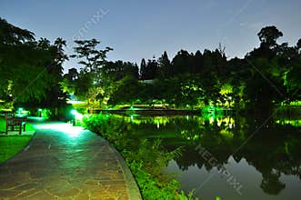 Walkway by the pond at night
