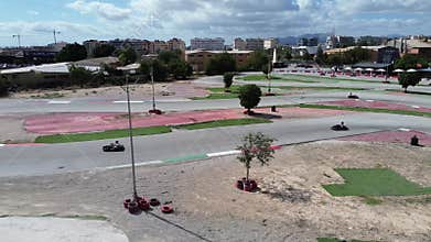 Thrill of speed in a vibrant gokart track with city views