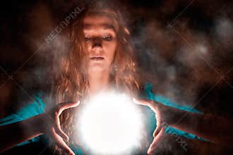 Magic woman with light sphere