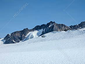 Glacier snow with mountains in the background