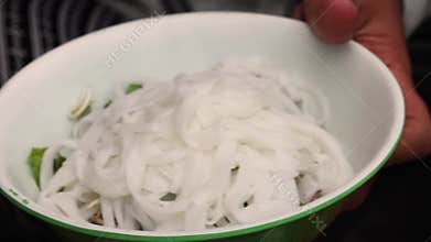 Asian street food. The process of making Vietnamese food Cao Lau