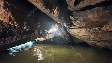 Inside view out of natural cave in Tam Coc scenic spot, Ninh Binh, Vietnam.