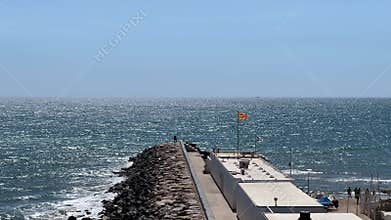 Scenic Rocky Pier with Catalan Flag