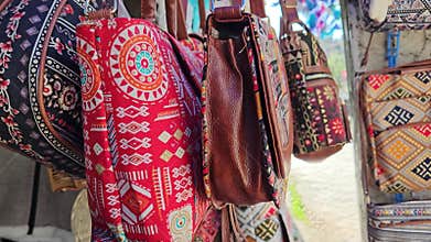 Splash of Colors of Various Hued Bags Adorning the Shelves in Dharamshala Stores