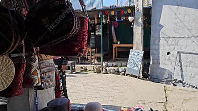 Market Stroll: Bags Gracefully Displayed Along the Lively Streets of Dharamshala