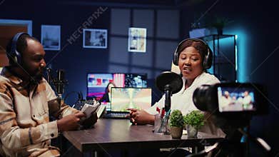 Entertainers doing podcasting session with filming equipment