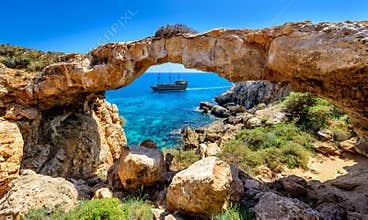 Pirate ship through rock arch,cyprus