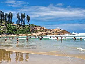 Florianopolis, Argentina - Dec 22, 2023: Joaquina beach with stone and dunes in Florianopolis, Santa Catarina, Brasil