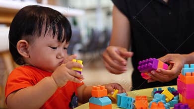 Mother And Child Playing With Blocks