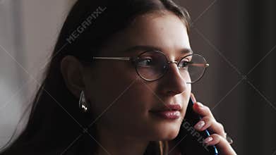 Focused business woman speaking mobile phone at home office in slow motion. Closeup smiling lady talking smartphone