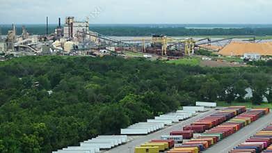 Cargo container yard with rows of freight containers at Brunswick cellulose and paper plant in Georgia, USA. Freight of