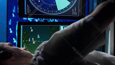 Workplace of the air traffic controllers in the control tower. Team of professional aircraft control officers works