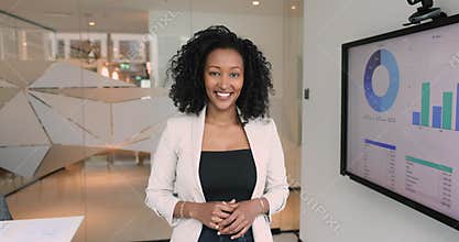 Portrait of professional African businesswoman analyst posing in office