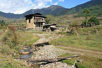 house, mountains and prairies at the phobjikha valley (bhutan)