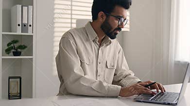 Arabian man Indian muslim ethnic businessman employee stand in corporate office with laptop smiling business