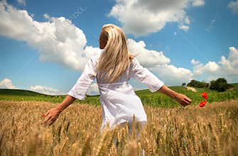 Joyful woman in summer field