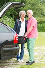 Senior couple with luggage