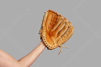 Hand of baseball player with glove isolated on gray. Baseball, active leisure, sports, championship