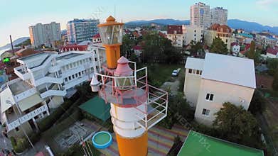 Beacon among house in town near mountains during
