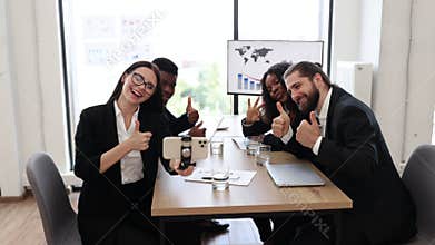 Business team taking selfie during meeting in modern office