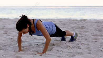Woman exercising on the beach