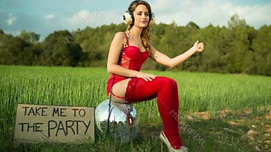 disco woman dancing and posing outdoors in lingerie