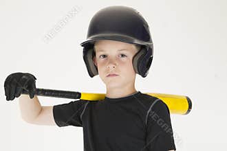 Young boy baseball player resting bat on his shoulder intense fa