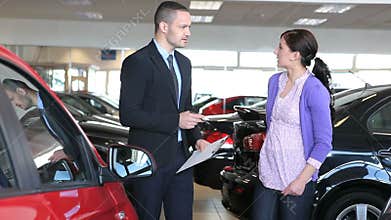Businessman showing a car