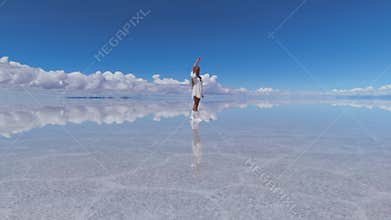 A woman points at the sky and walks on the expansive Salar de Uyuni salt flats in Bolivia, under a clear blue sky