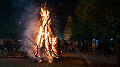 Holika Dahan, ritual bonfire, evening before the holi festival in India, symbol for burning the evil, triumph of good, Hampi,