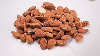 Pile of Almonds nuts on a white background