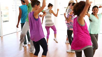 Zumba class dancing in studio