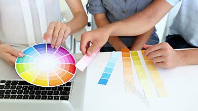 Pretty interior designer working with clients