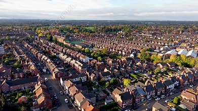 Aerial view above suburban generic terraced houses in UK