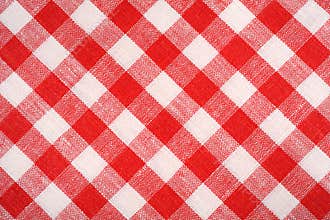 Red and white plaid fabric. Linen red checkered. Background and texture.