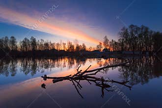 Rural summer sunrise landscape with river and dramatic colorful sky