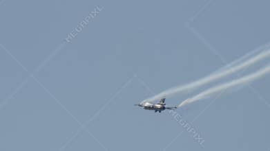 Fighter Jet Performing Aerobatics with Smoke Trails